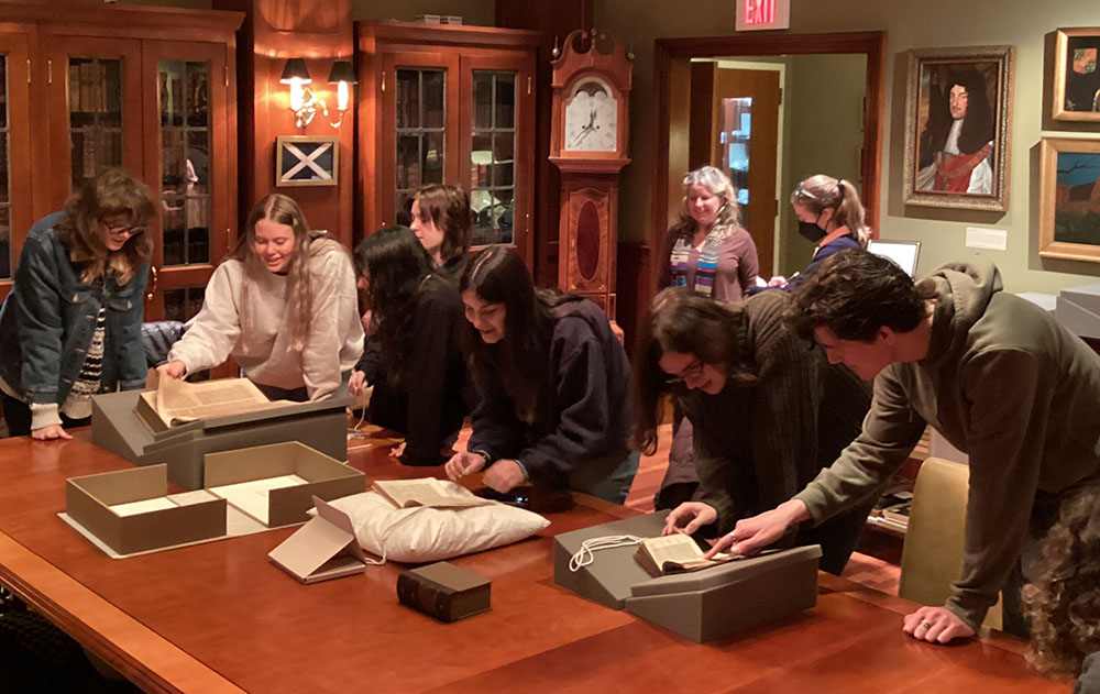 Students look at rare books in the Rhinehart Room
