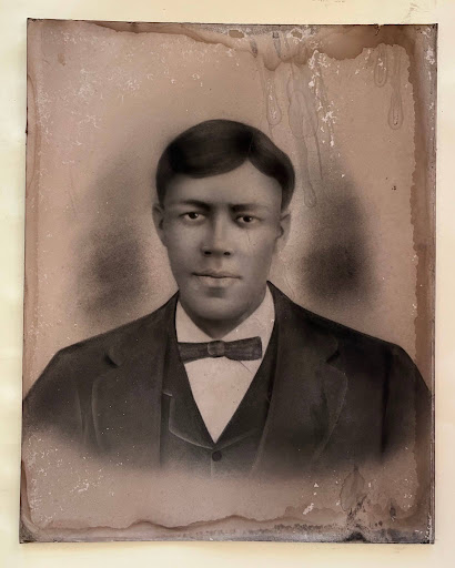 Portrait of a young African American man in formal attire