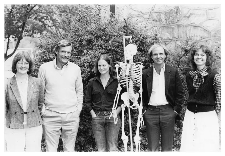 Faculty members of the Anthropology Department standing with a model skeleton