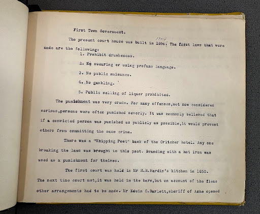 Handwritten student page describing early justice practices in Boone.