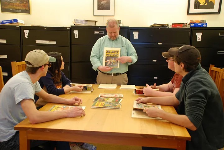 Craig Fischer discusses comic book cover to students