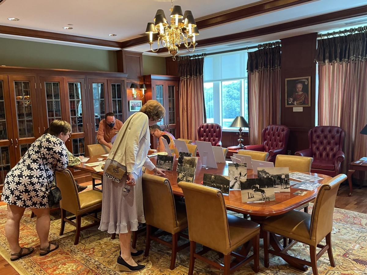 Camp Yonahlossee alumnae view collection materials in the Rhinehart Rare Book Room
