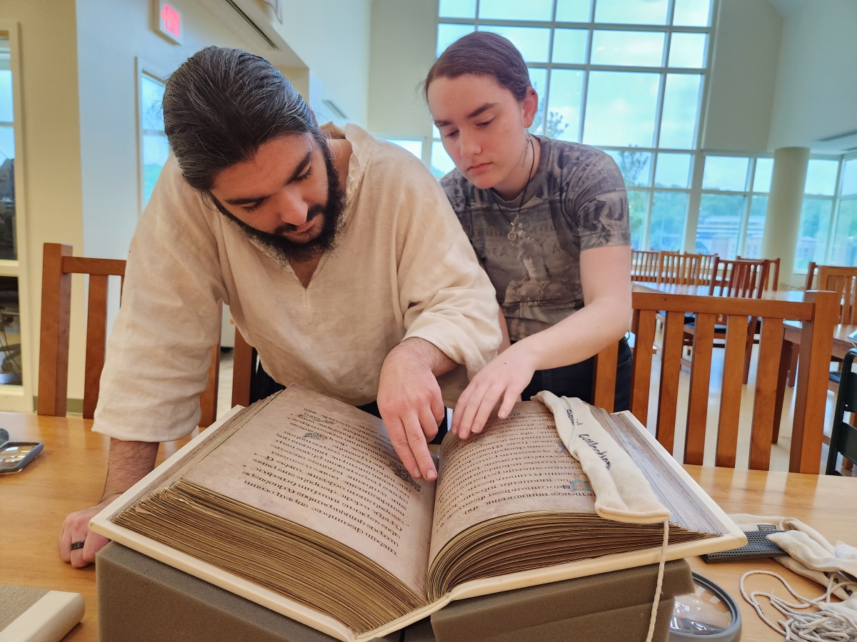 Two students get a chance to have an early look at the art facsimile Book of Kells