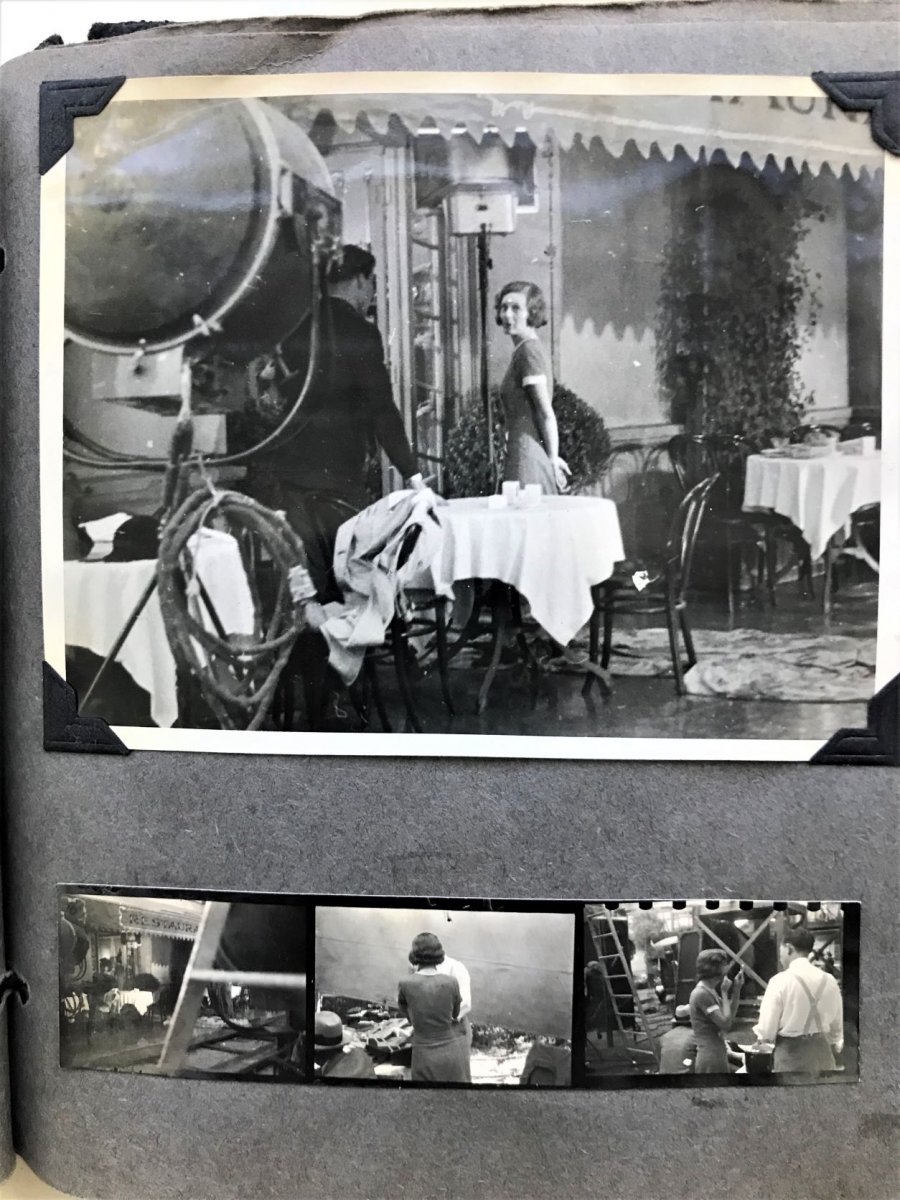 A page from one of Lewis’ scrapbooks showing photographs of Irene Dunne on a film set.