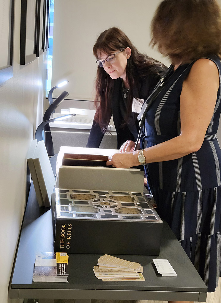 Participants view rare books