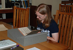 Researcher looking at a rare book