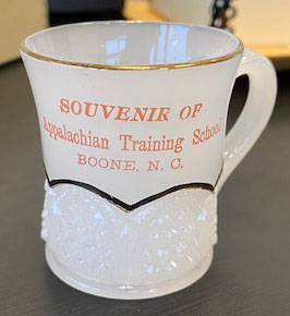 Souvenir milk cup from Appalachian Training School (1903–1925)