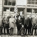 The Colored Department of Norfolk and Western Railroad Y.M.C.A. photograph, AC 266, depicts 15 African Americans standing in front of a building with a sign reading 