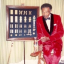 George SerVance in a red suit with his limberjacks 