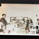 Seven African American young men seated together for a portrait, possibly in a building of a college or university