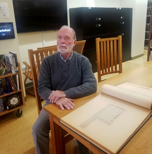 Dr. Donald Secreast with his scrapbook