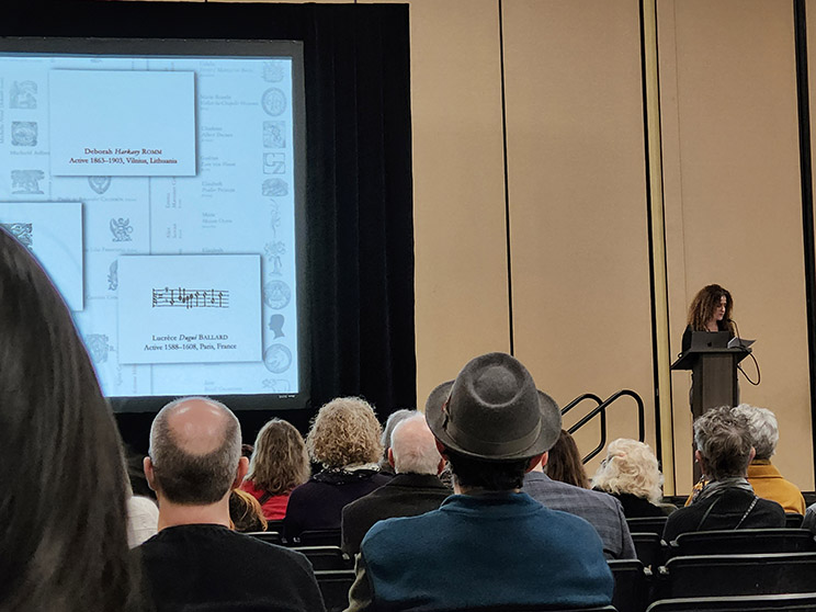 Carole Texier speaking at the symposium